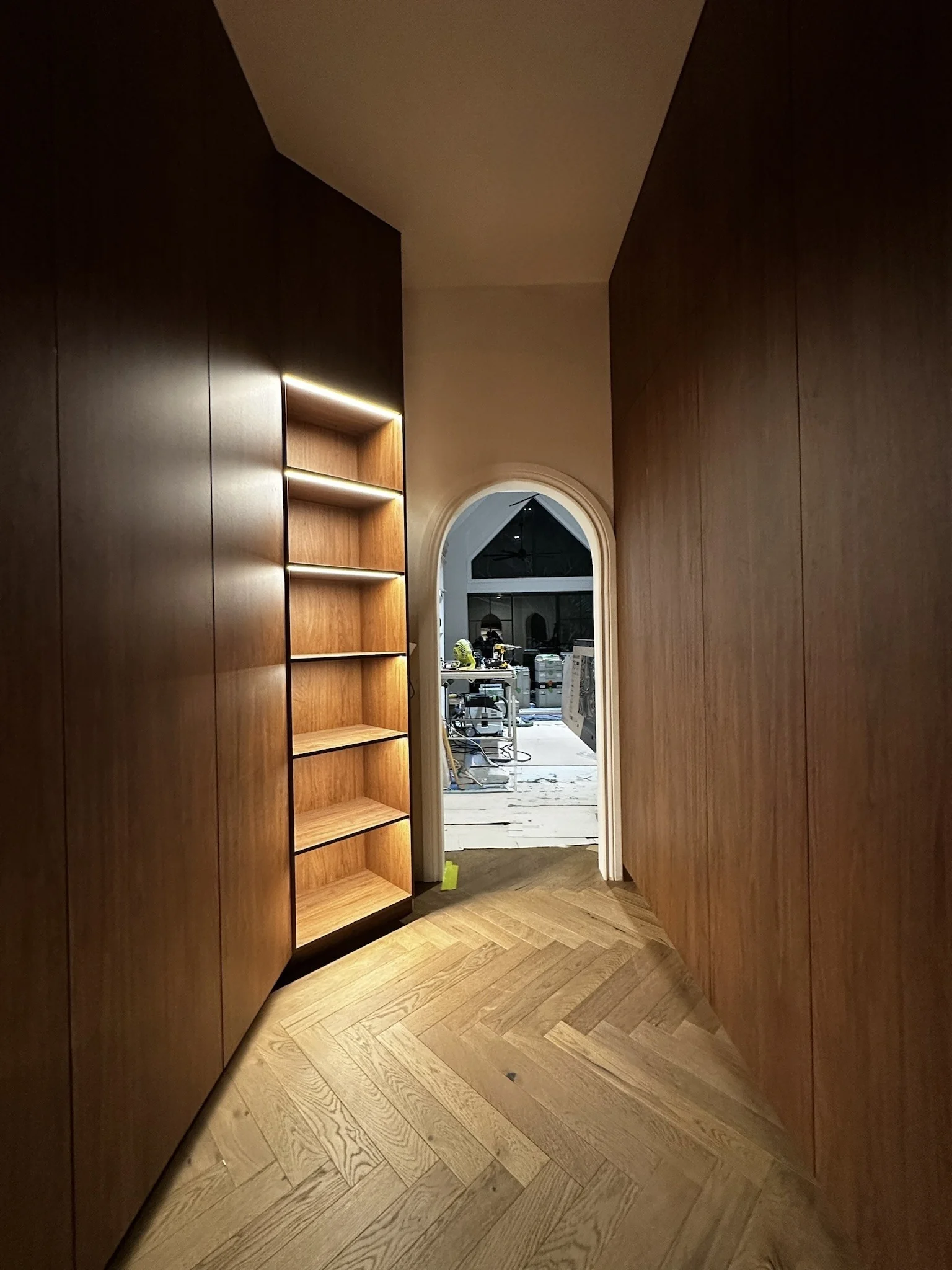 Walnut wardrobe corridor with herringbone flooring during construction, Gold Coast