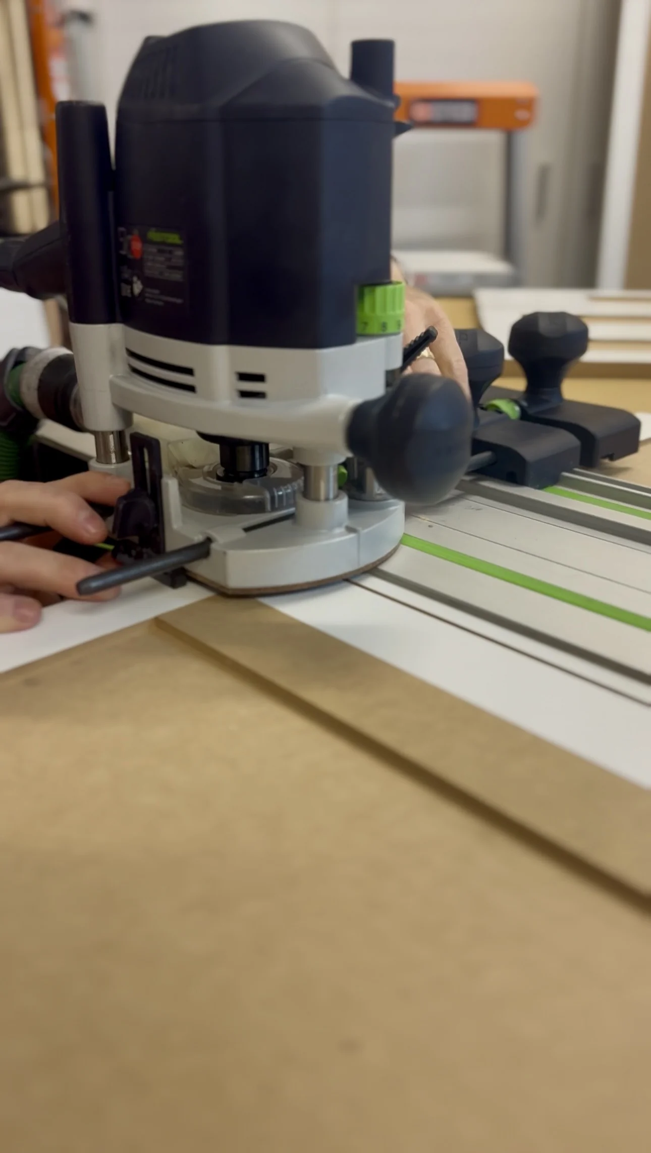 Close-up of a plunge router set up for precision joinery cuts