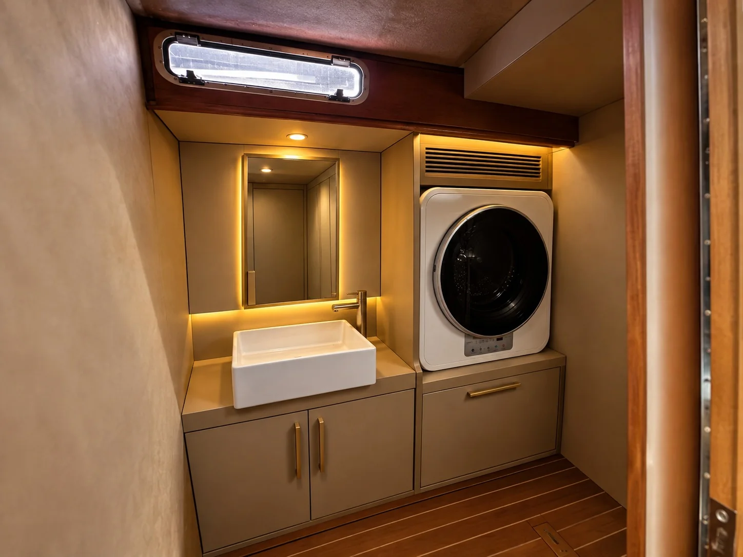 Custom campervan laundry cabinetry with integrated sink and washing machine