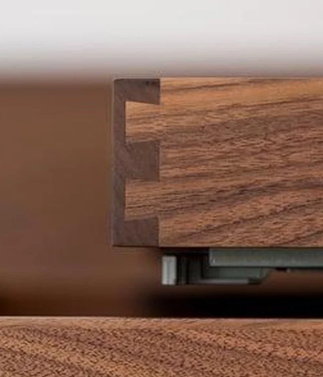 Dark timber wardrobe island with integrated lighting